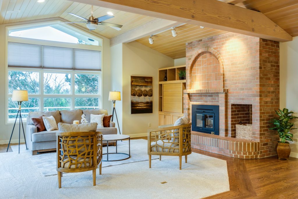 a well home-staged living room with well-lit interiors and themed furniture