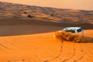 dubai desert safari , white car