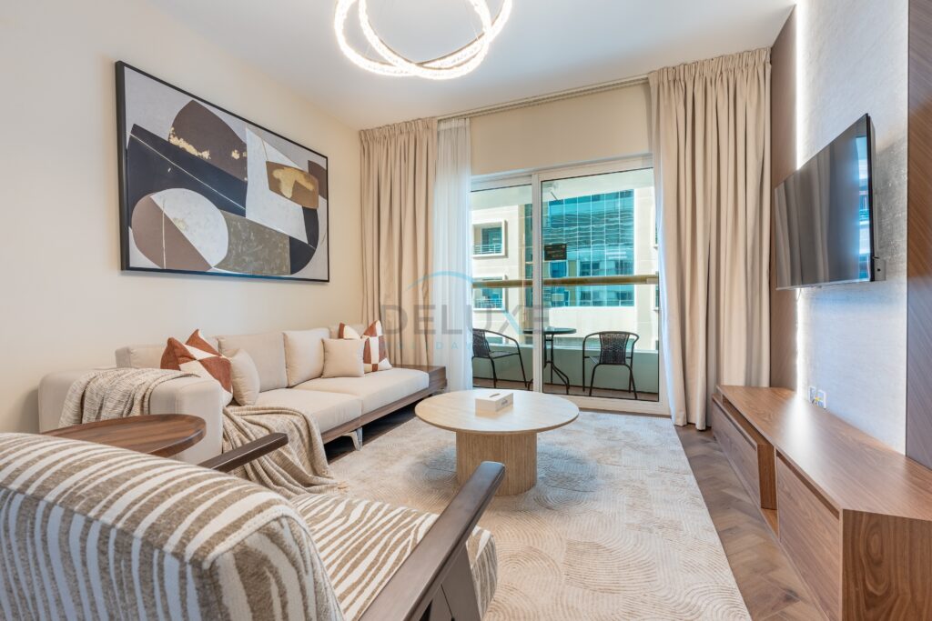 Sophisticated High-Floor 1BR with Balcony Featuring Partial Sea Views, Prime Location Steps from the Tram, Elite Residence