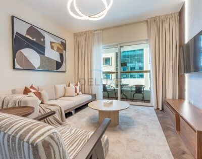 Sophisticated High-Floor 1BR with Balcony Featuring Partial Sea Views, Prime Location Steps from the Tram, Elite Residence